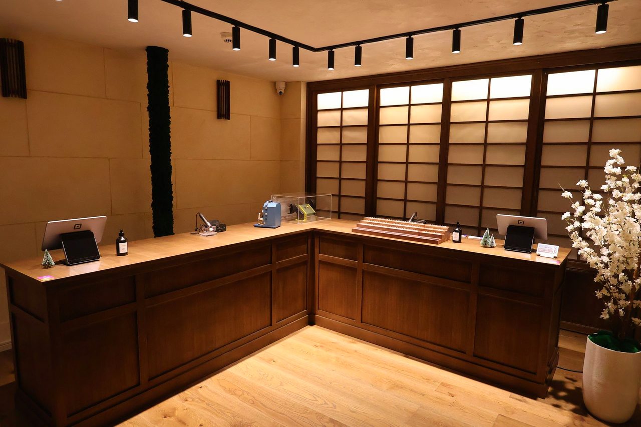 Finished retail interior with perimeter track lighting and shoji panels in York city centre